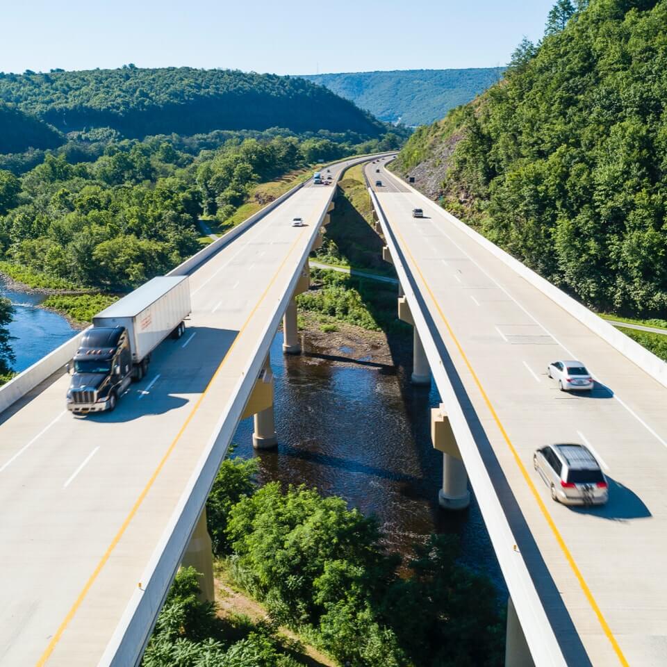 Cars and trucks driving on overpass