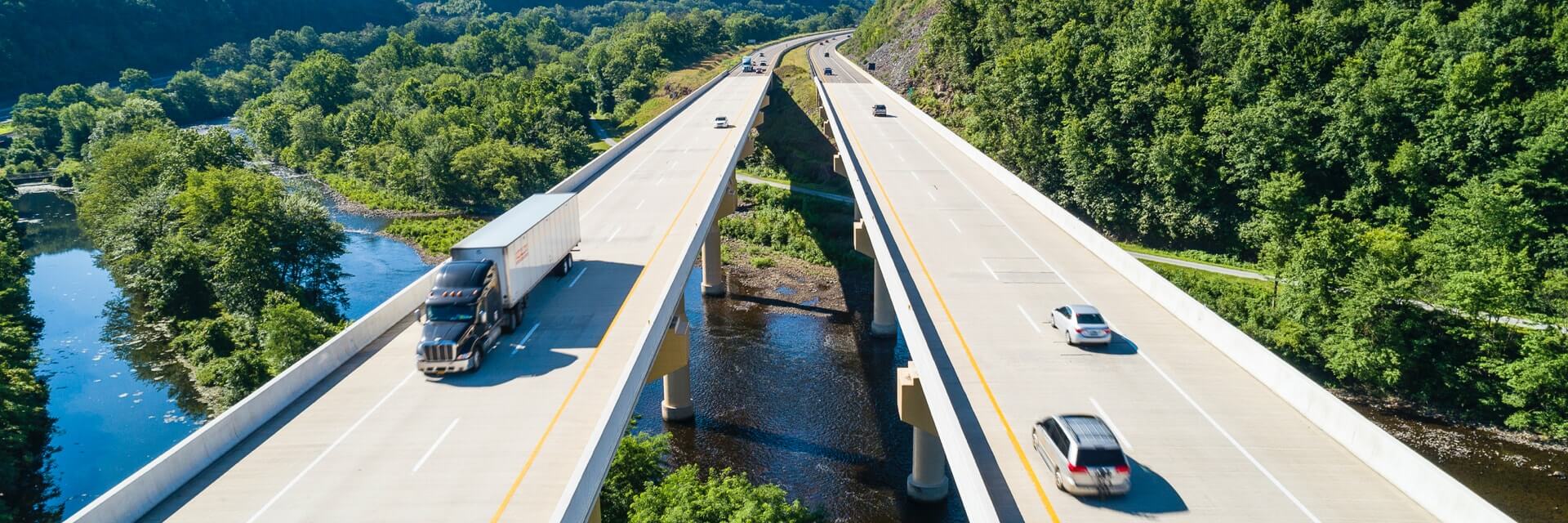 Cars and trucks on highway overpass