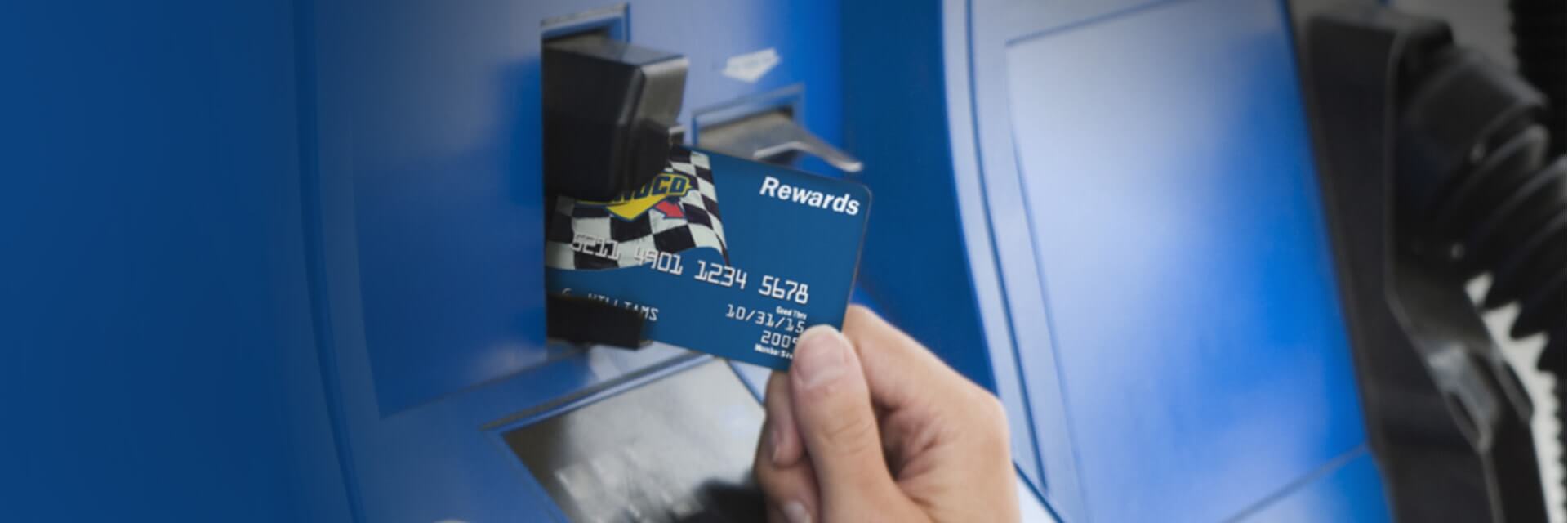 Sunoco rewards card being inserted into Sunoco fuel pump